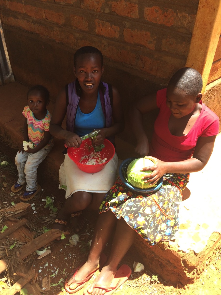 Orphans helping prepare lunch